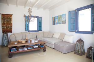 a living room with a couch and a coffee table at Luxury house in the island of Patmos in Grikos