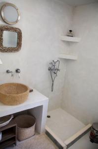 a bathroom with a sink and a shower at Luxury house in the island of Patmos in Grikos