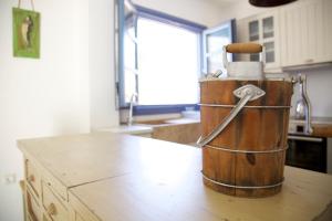 a wooden bucket sitting on top of a kitchen counter at Luxury house in the island of Patmos in Grikos