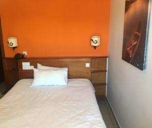 Postel nebo postele na pokoji v ubytování Hotel Olympion