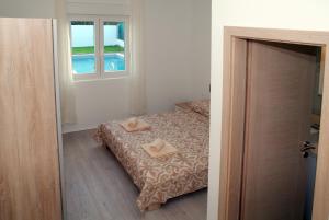 Posteľ alebo postele v izbe v ubytovaní Holiday Home Luka