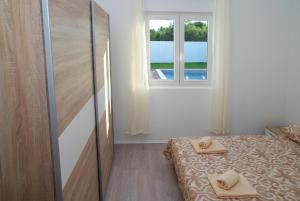 Posteľ alebo postele v izbe v ubytovaní Holiday Home Luka