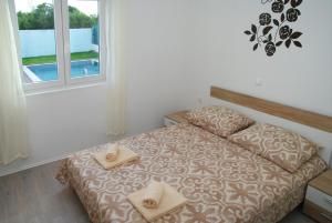 Posteľ alebo postele v izbe v ubytovaní Holiday Home Luka
