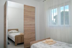 Posteľ alebo postele v izbe v ubytovaní Holiday Home Luka