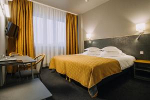 Postel nebo postele na pokoji v ubytování Centrum Hotel Viljandi