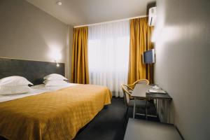 Postel nebo postele na pokoji v ubytování Centrum Hotel Viljandi