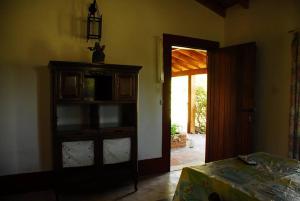 a room with a dresser and a door to a room at Rancho La Peregrina in Nono +80 photos