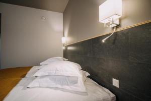 Postel nebo postele na pokoji v ubytování Centrum Hotel Viljandi