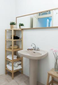 a bathroom with a sink and a mirror at Victoria Site-Luxury Center in Valencia +79 photos