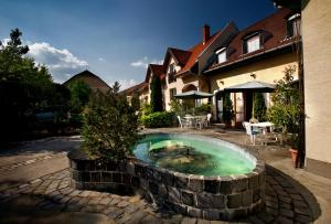 a swimming pool in the middle of a house at Keszi Panzió in Budakeszi