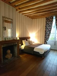 Voodi või voodid majutusasutuse Côté Jardin - Chambres d'hôtes toas