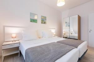 Кровать или кровати в номере Apartamentos Baltum