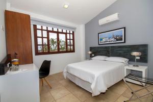 Postel nebo postele na pokoji v ubytování Hotel Volcano
