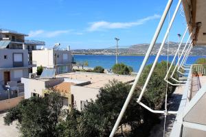 una vista de un cuerpo de agua desde un edificio en Apartment SEA VIEW in front of the beach of Agia Marina, en Porto Rafti
