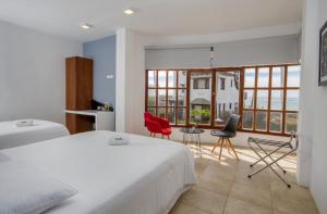 Postel nebo postele na pokoji v ubytování Hotel Volcano