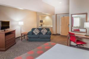 A television and/or entertainment center at Ramada by Wyndham Hammond Hotel & Conference Center