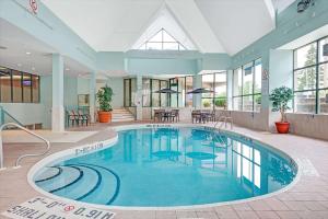 a large swimming pool in a large building at Ramada by Wyndham Niagara Falls/Fallsview in Niagara Falls