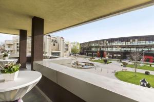 an office building with a view of a courtyard at Ramada Iasi City Center in Iaşi