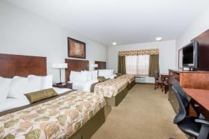 Voodi või voodid majutusasutuse Ramada by Wyndham Olds toas
