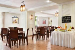 A restaurant or other place to eat at Ramada by Wyndham Tashkent