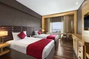 Ramada by Wyndham Alleppey客房内的一张或多张床位