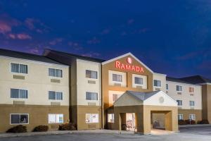 a hotel with a sign that reads ramada at Ramada by Wyndham Coeur d'Alene in Coeur d'Alene