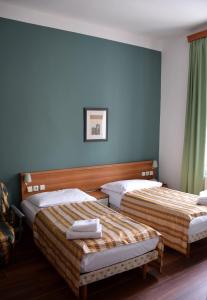 Postel nebo postele na pokoji v ubytování Hotel Residence Select