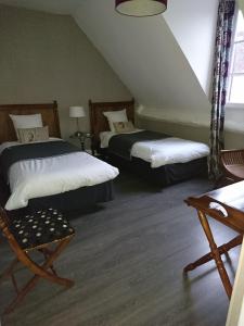 Ein Bett oder Betten in einem Zimmer der Unterkunft Côté Jardin - Chambres d'hôtes