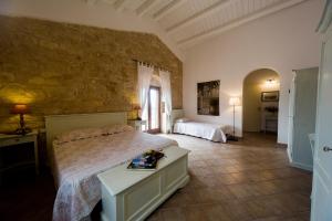 מיטה או מיטות בחדר ב-Nacalino Agriturismo
