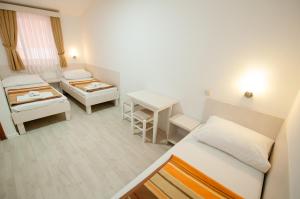 Postel nebo postele na pokoji v ubytování Pansion Obala