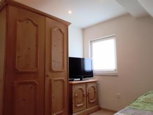 TV a/nebo společenská místnost v ubytování Fiore Gästezimmer