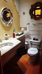 a bathroom with a toilet and a sink at Hotel Posada Pablo de Tarso in San Patricio Melaque +37 photos