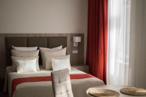 Posteľ alebo postele v izbe v ubytovaní Harmonia Palace