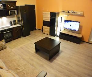 Кът за сядане в 220 Apartment on Staroobrydcheskaya