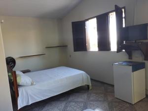 Postel nebo postele na pokoji v ubytování Pousada Aconchego