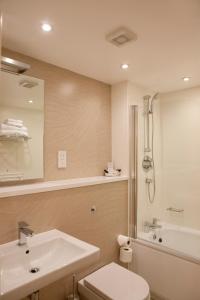 Ett badrum på Malvina House Hotel