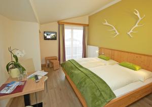 Postel nebo postele na pokoji v ubytování Comfort Hotel Garni Landhaus Gitti