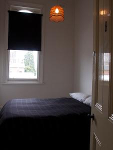 Ένα ή περισσότερα κρεβάτια σε δωμάτιο στο Western Hotel Ballarat