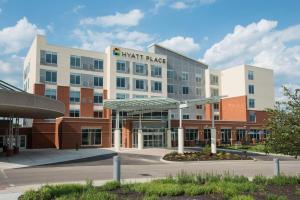 a large building with a math palace sign on it at Hyatt Place Cincinnati/Sharonville Convention Center in Sharonville
