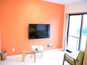 TV a/nebo společenská místnost v ubytování Mango Resort Okinawa Chatan