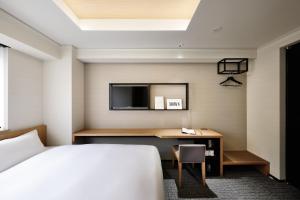 Postel nebo postele na pokoji v ubytování LAMP LIGHT BOOKS HOTEL nagoya