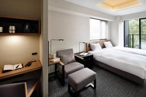Postel nebo postele na pokoji v ubytování LAMP LIGHT BOOKS HOTEL nagoya