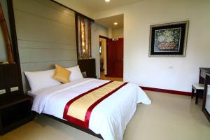 Rúm í herbergi á Penghu Luna Sea Homestay