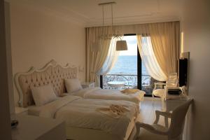 Voodi või voodid majutusasutuse Bab-i Zer Hotel toas