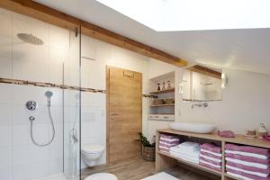 a bathroom with a shower and a sink at Haus Sonnblick in Wangle