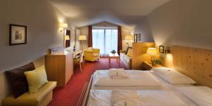 Postel nebo postele na pokoji v ubytování Hotel St. Anton
