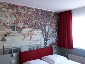 Postel nebo postele na pokoji v ubytování Hotel Aigner