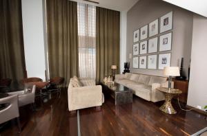 a living room with a couch and chairs at Agrinio Imperial Hotel in Agrinio