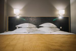 Postel nebo postele na pokoji v ubytování Centrum Hotel Viljandi