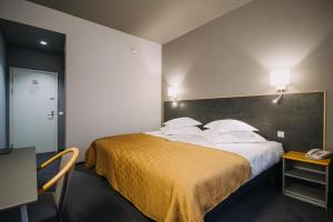 Postel nebo postele na pokoji v ubytování Centrum Hotel Viljandi